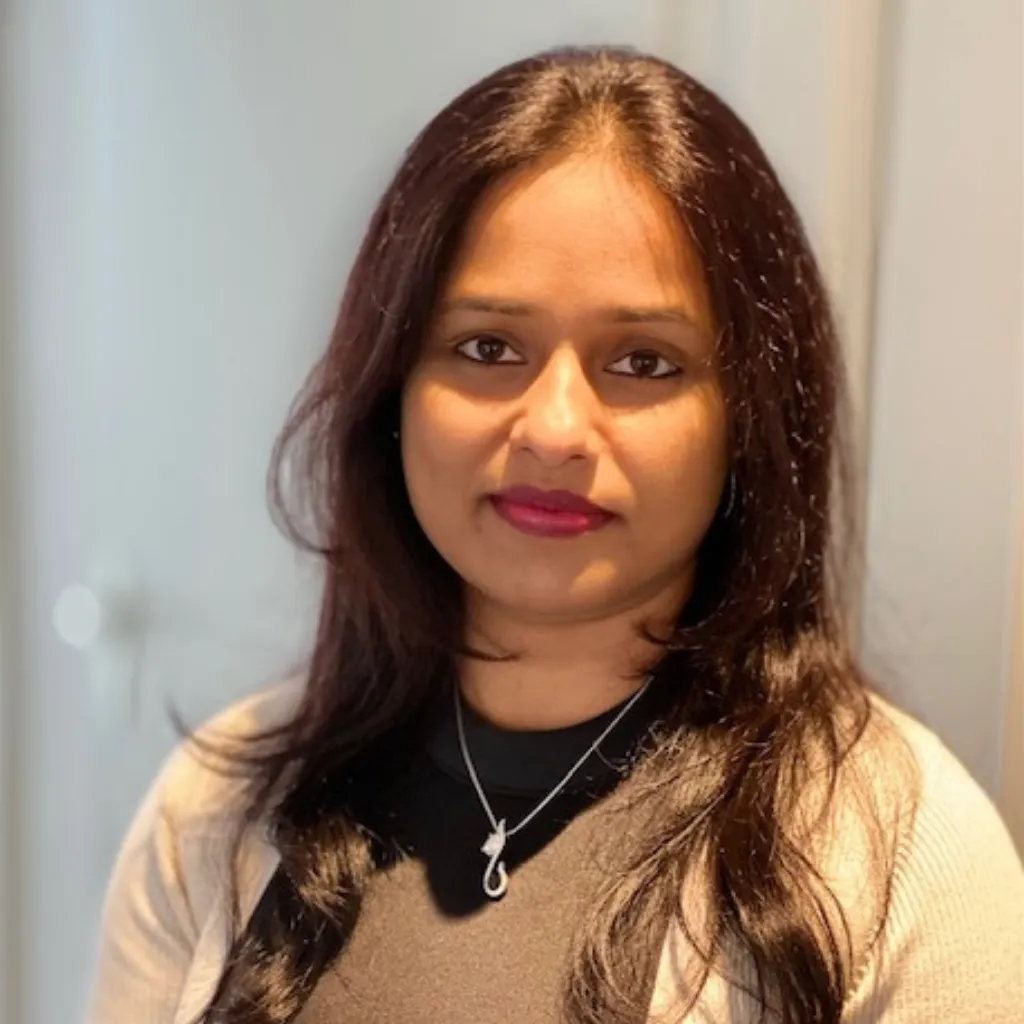 A profile picture of Priyanka looking into the camera