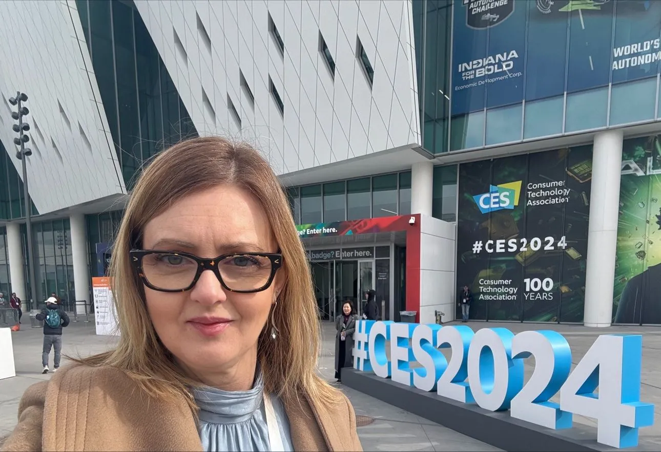 Anat Nulman from Envision posing in front of the CES venue in Las Vegas. The photo is a landscape selfie.