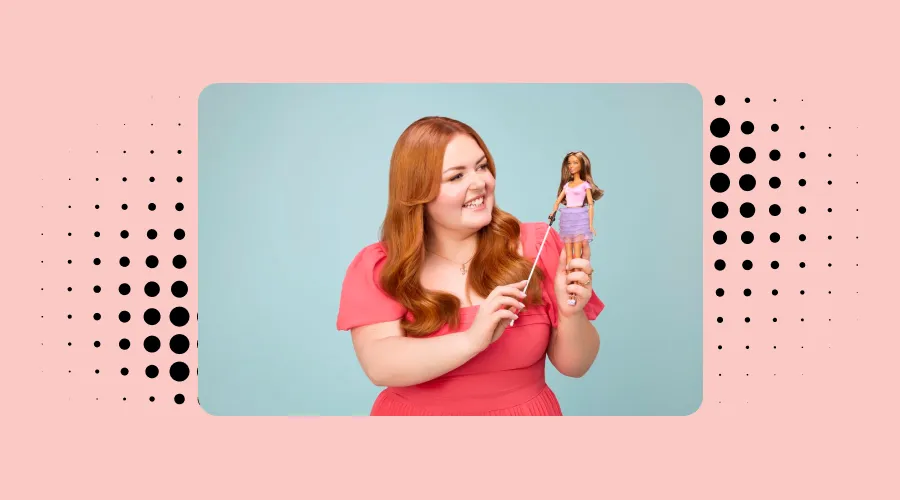 Lucy edwards holding a blind barbie