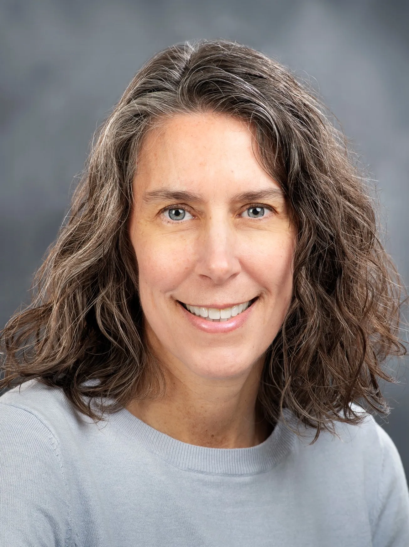 headshot of dr. michelle mcdonall. she is smiling!