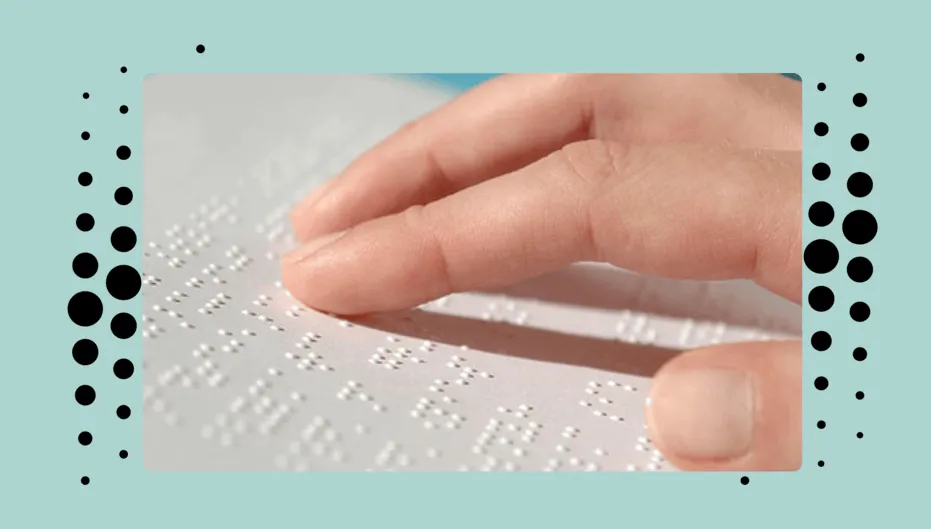 A picture of a finger softly touching the braille language on a piece of paper