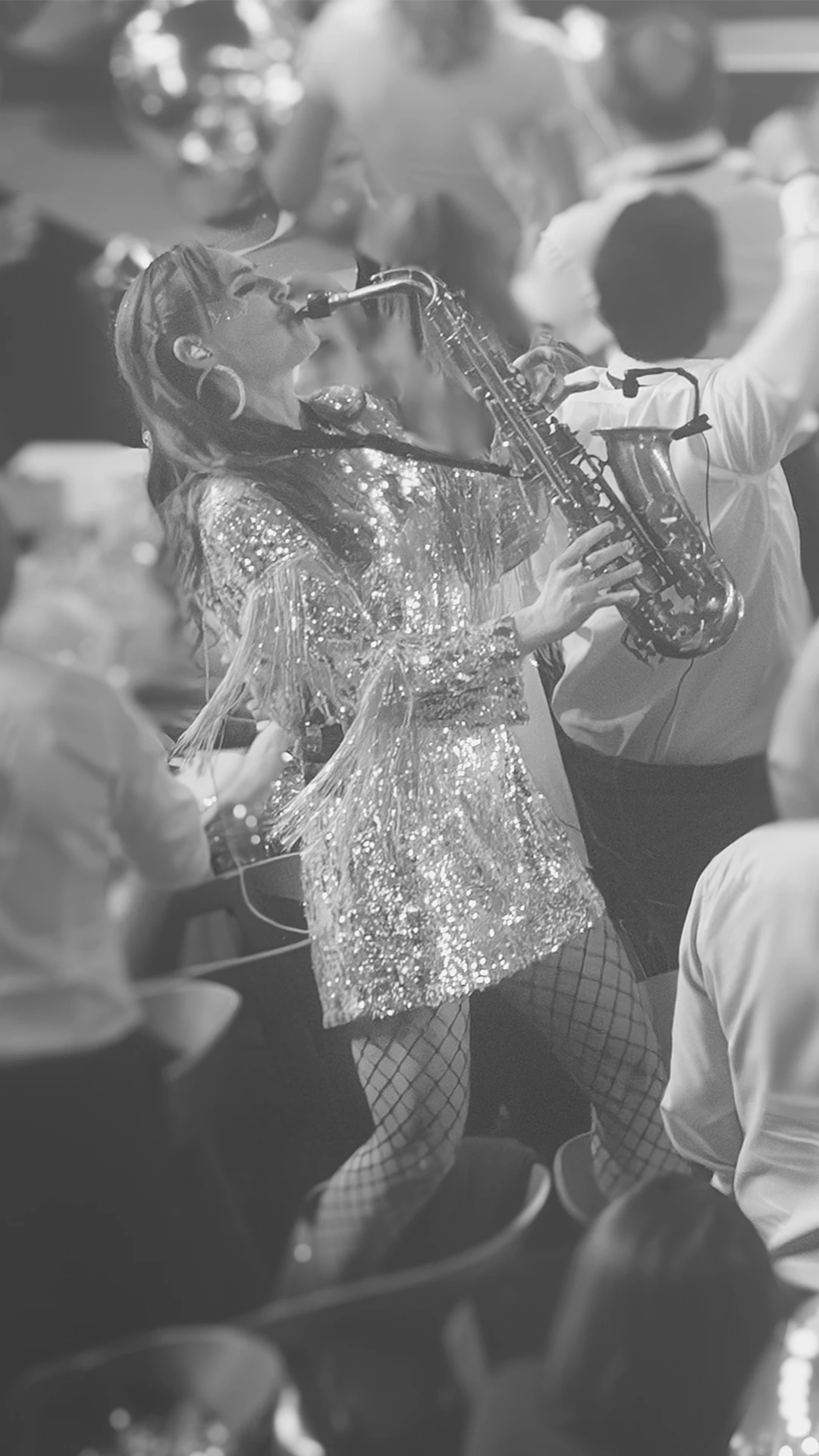 Saxofonist i publiken