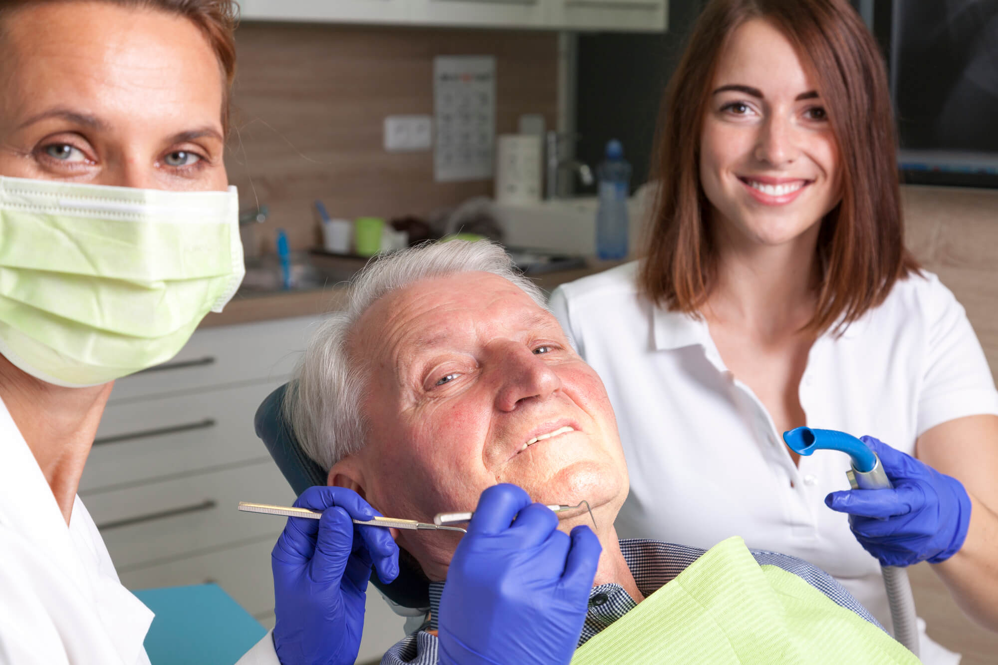 elderly patient receiving emergency dentistry in Marco Island