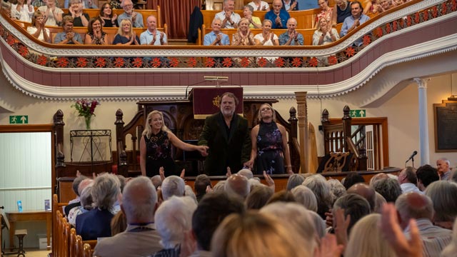 Sir Bryn Terfel with Annabel Thwaite and Hannah Stone on stage at Three Crosses.