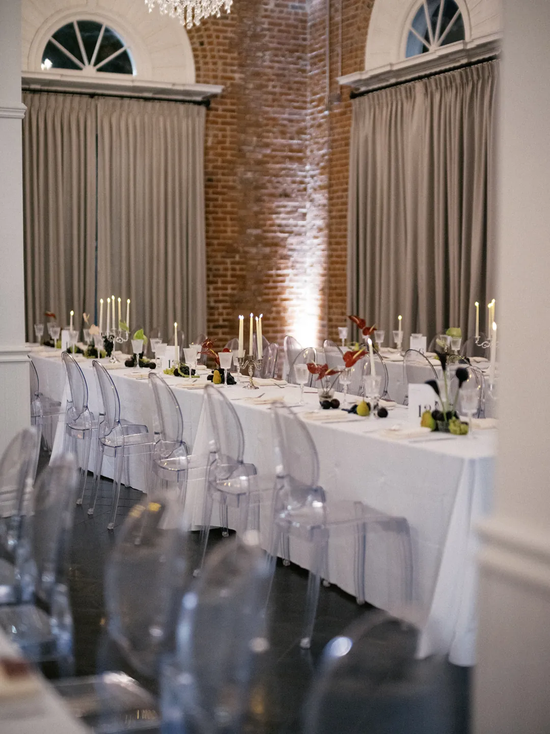Long reception tables set with white linens