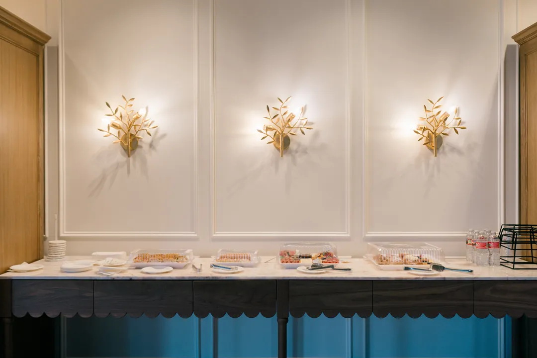 Food platters displayed along a buffet counter