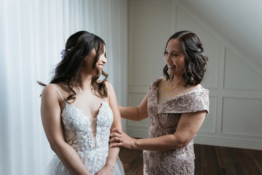 Guest helping the bride get ready