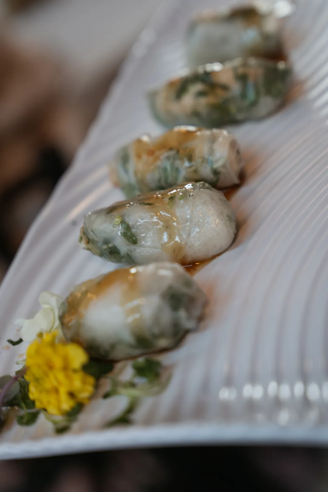 Small appetizers arranged on a white platter