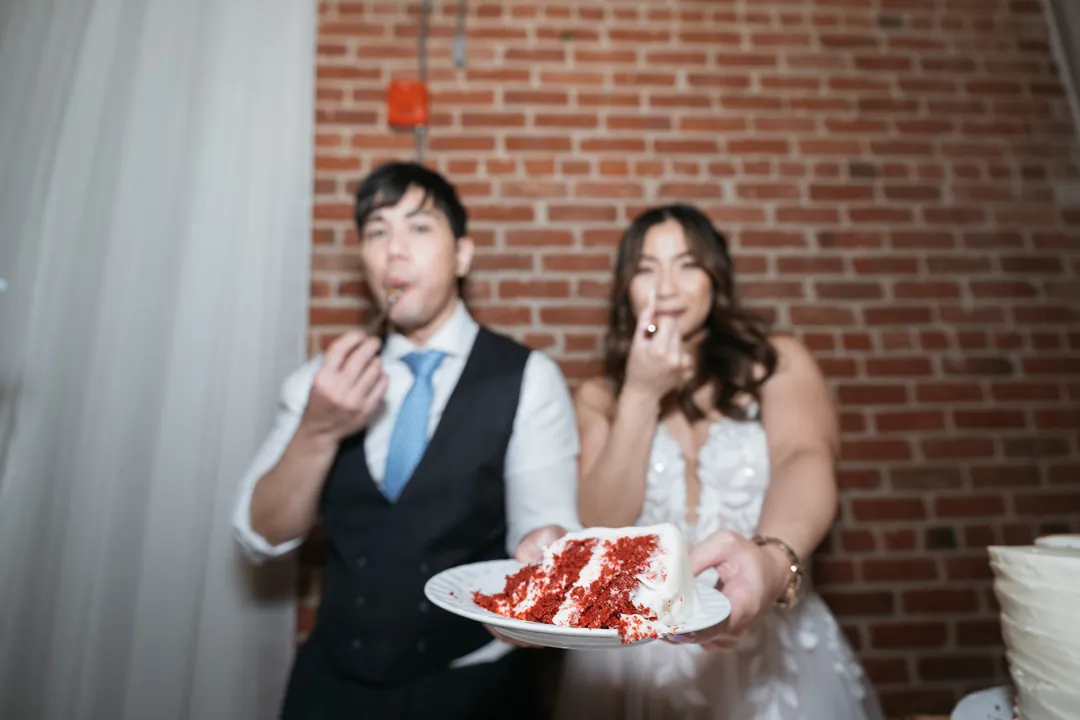 Couple holding a plate of cake