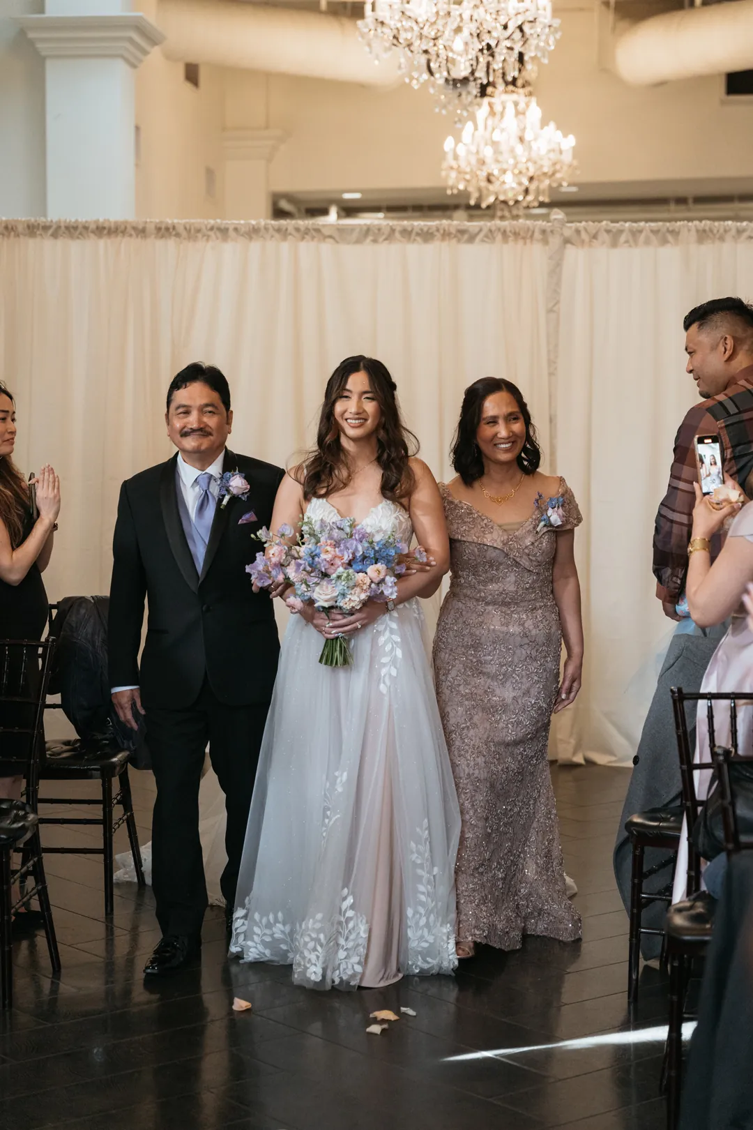 Bride walking down the aisle with wedding guests