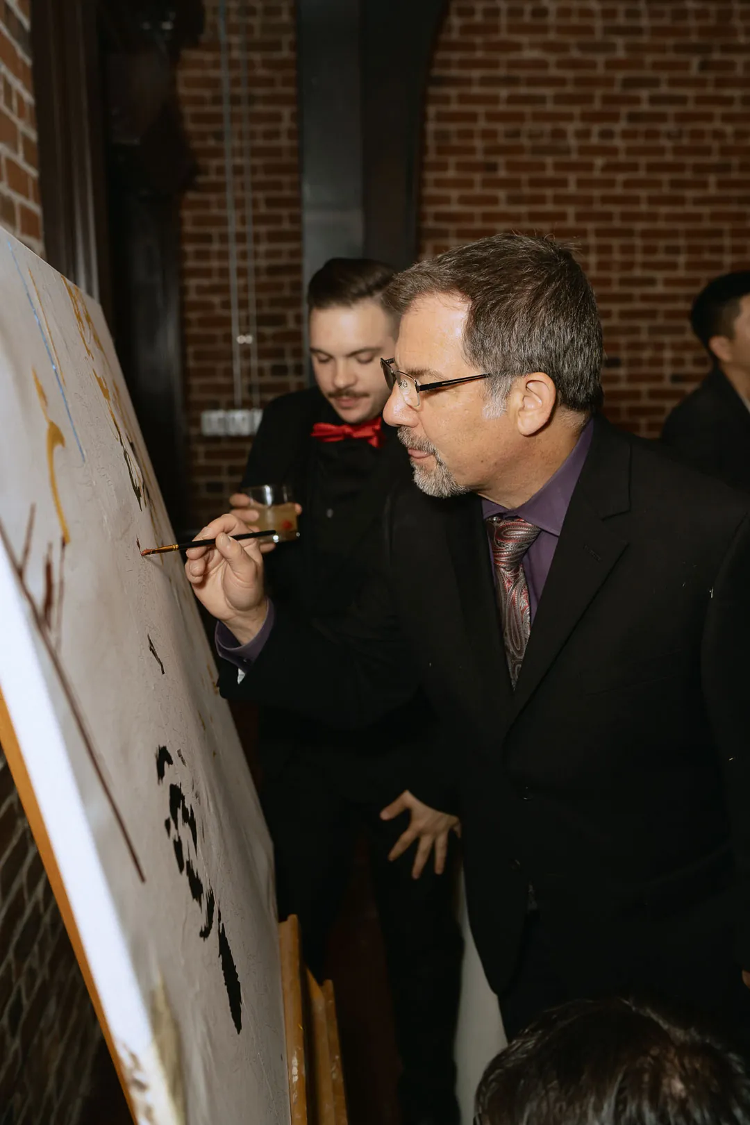 Guest writing on a wedding display board
