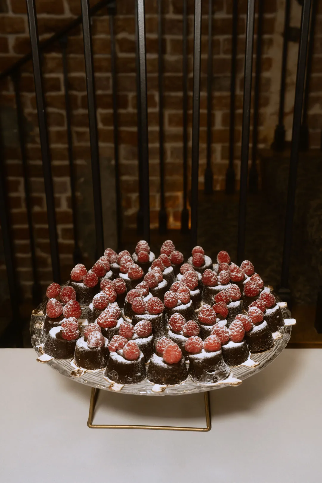 Chocolate covered berries on a dessert stand