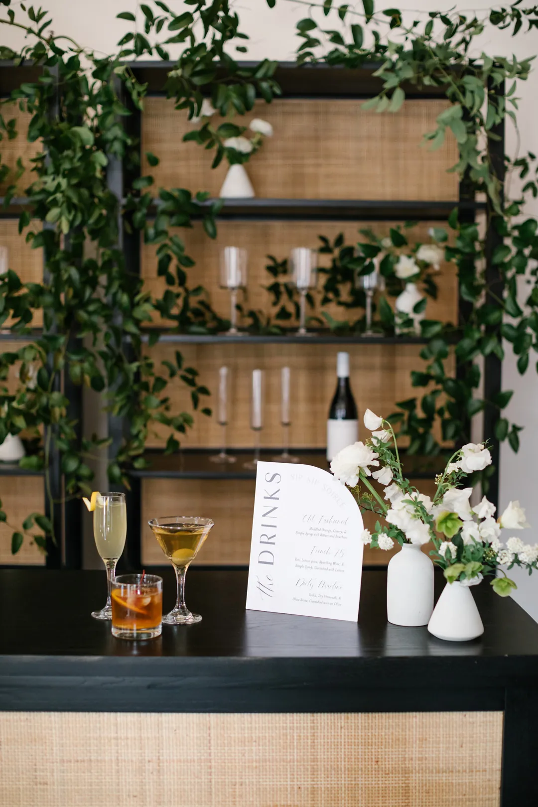 Flowers and drinks menu on a bar counter
