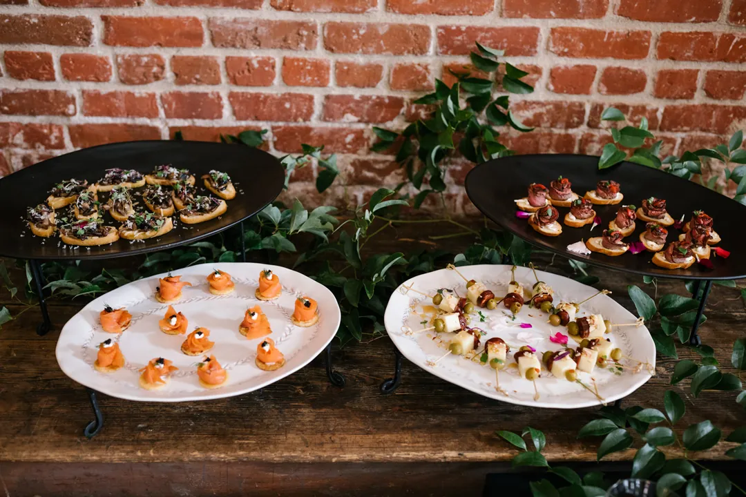 Appetizer platters arranged on a wooden table