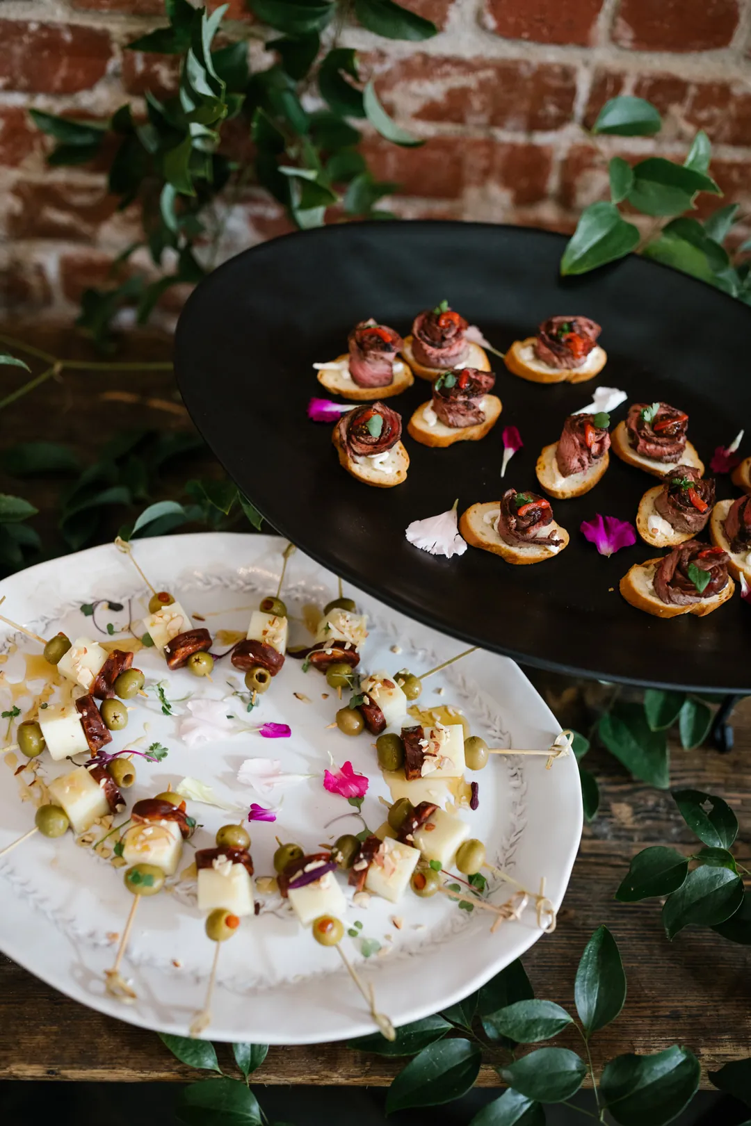 Appetizers arranged on decorated serving platters