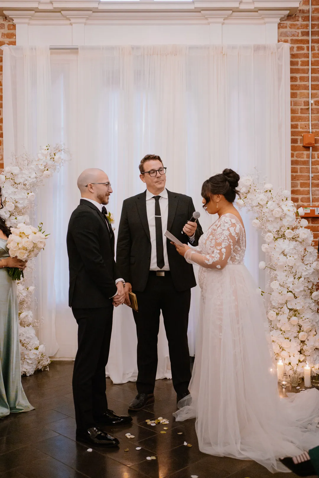 Couple exchanging vows in front of an officiant