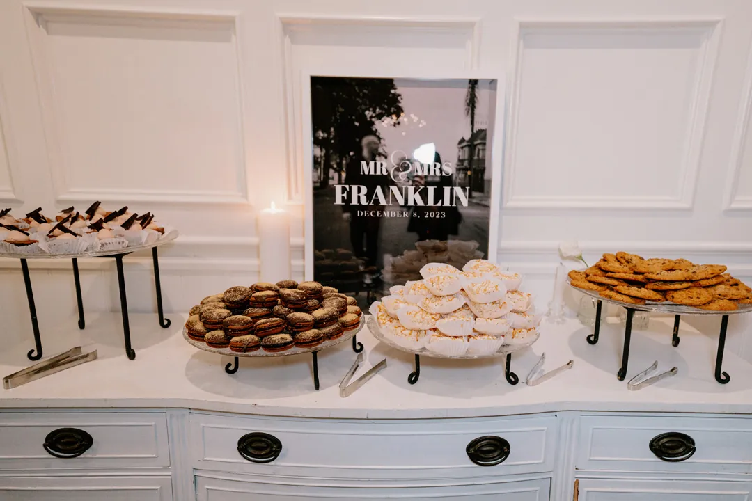 Desserts displayed on a dresser beneath framed lettering