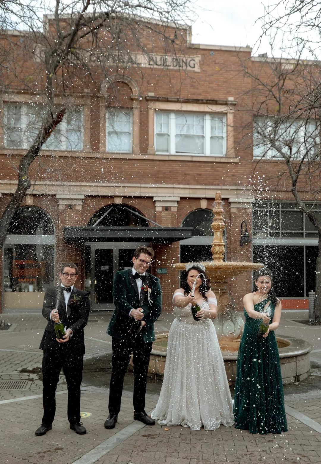 Wedding party posing together on a city street