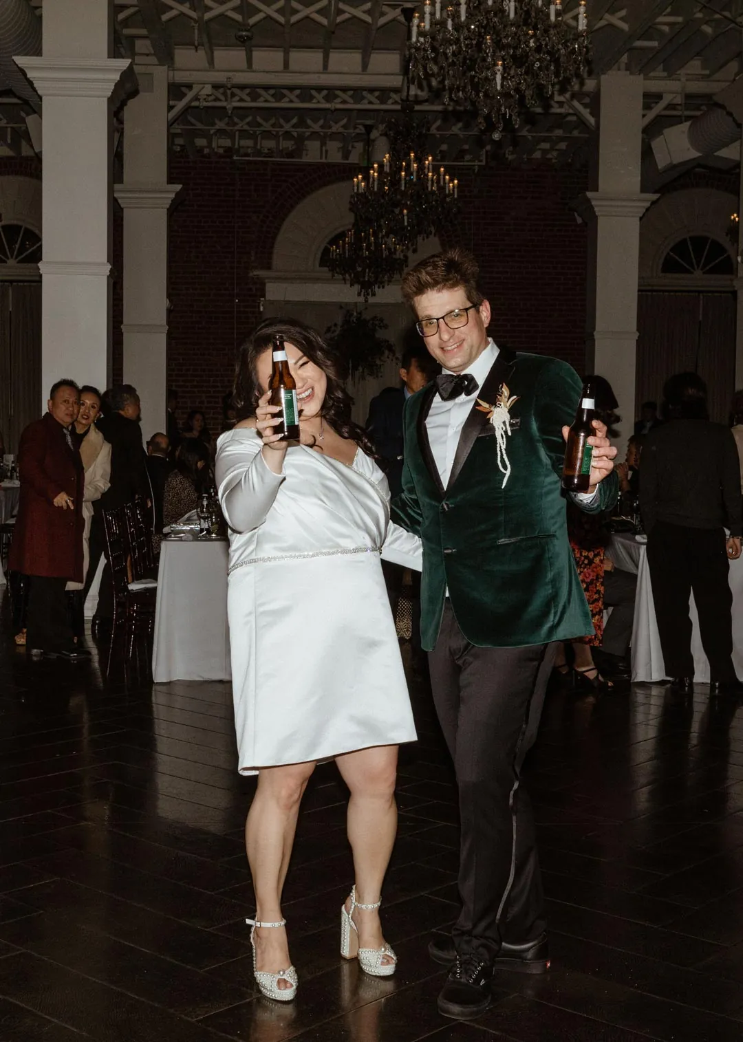 Couple dancing together in a dim reception room