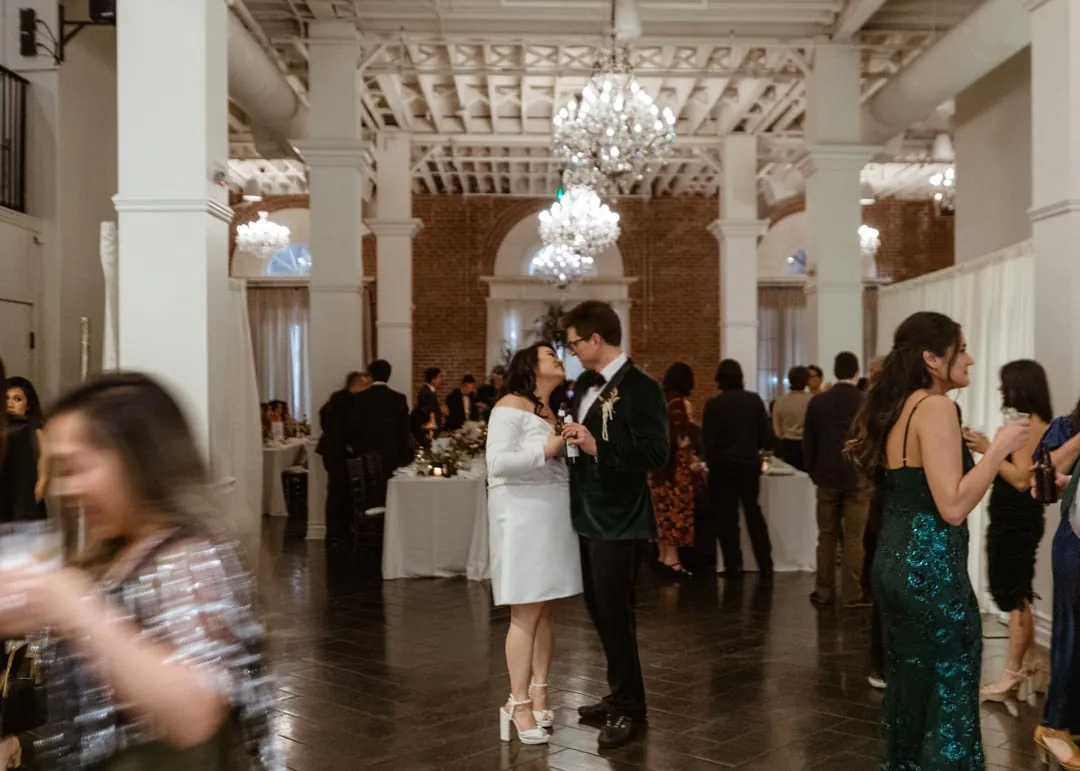 Bride celebrating with guests in the reception room