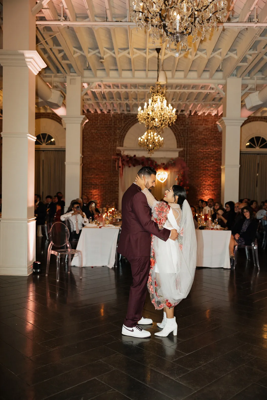 Couple dance together in the ballroom.