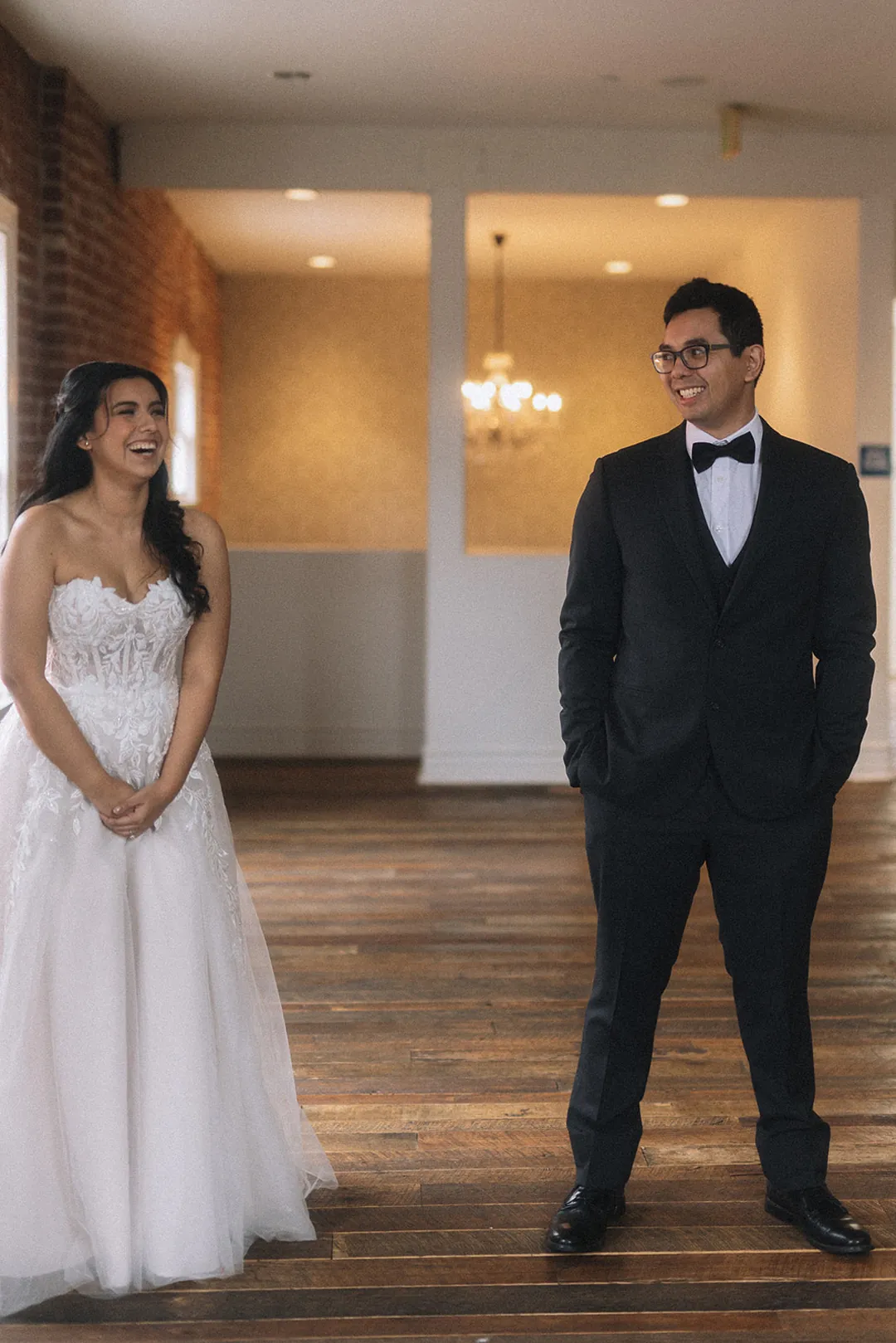 Couple turning toward one another in a sunny room