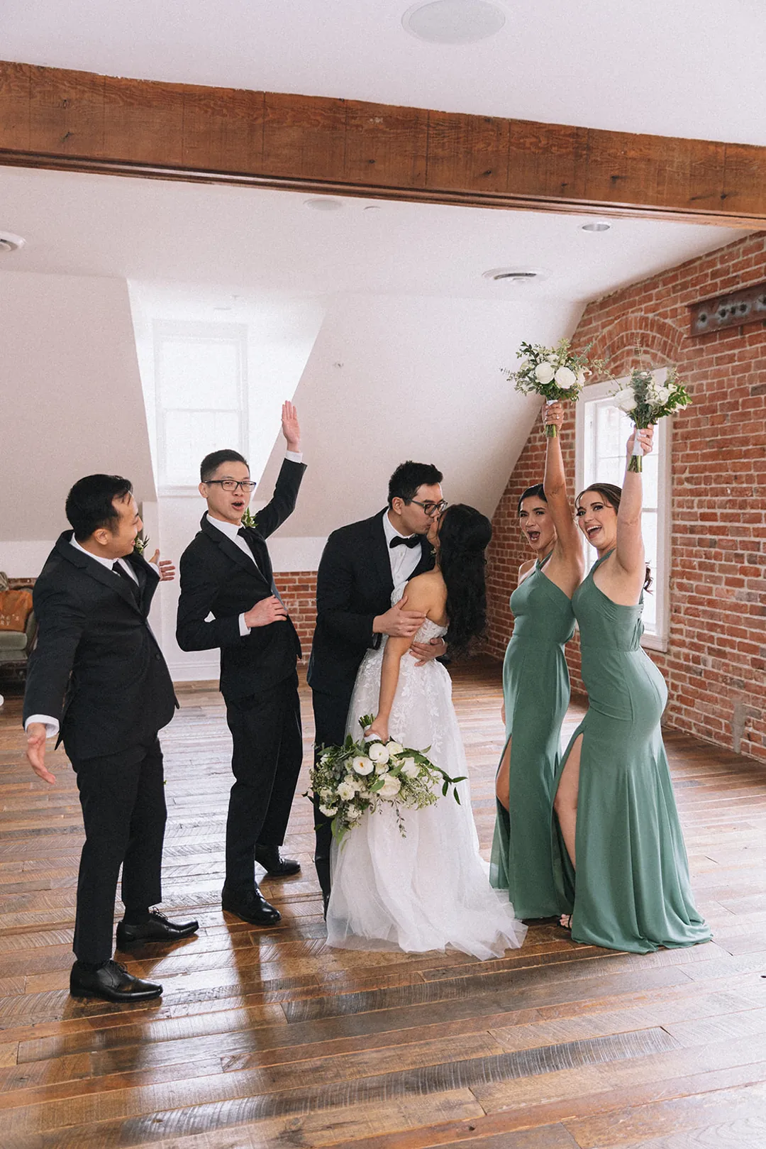 Wedding party celebrating together indoors