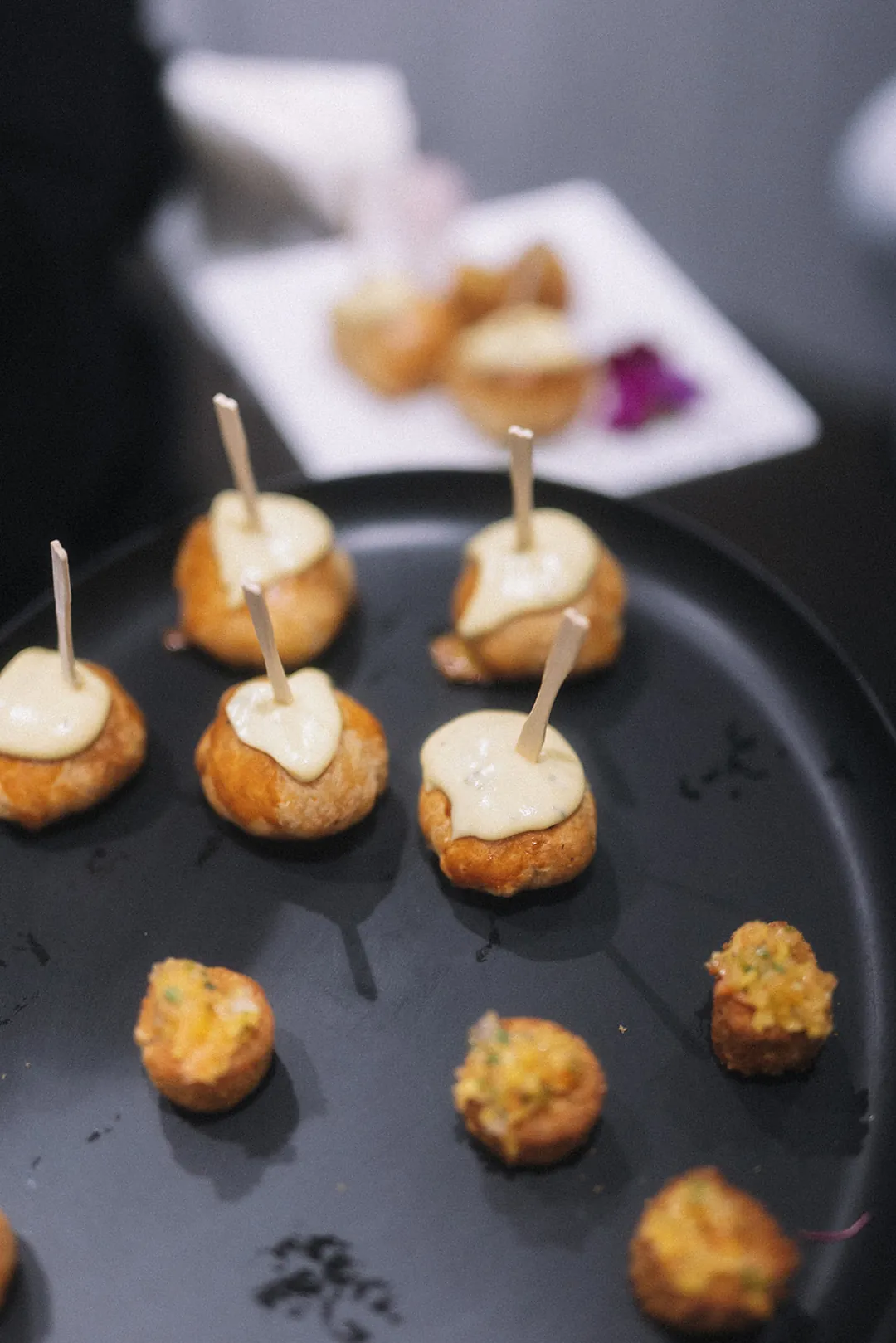 Small appetizers with skewers on a serving platter