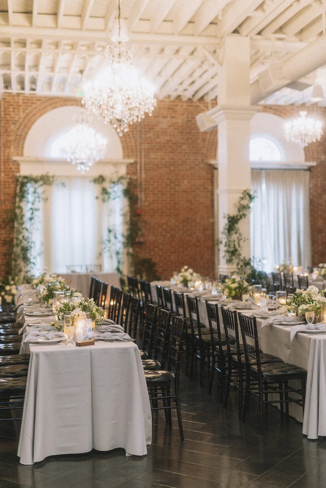 Reception tables with flowers and place settings
