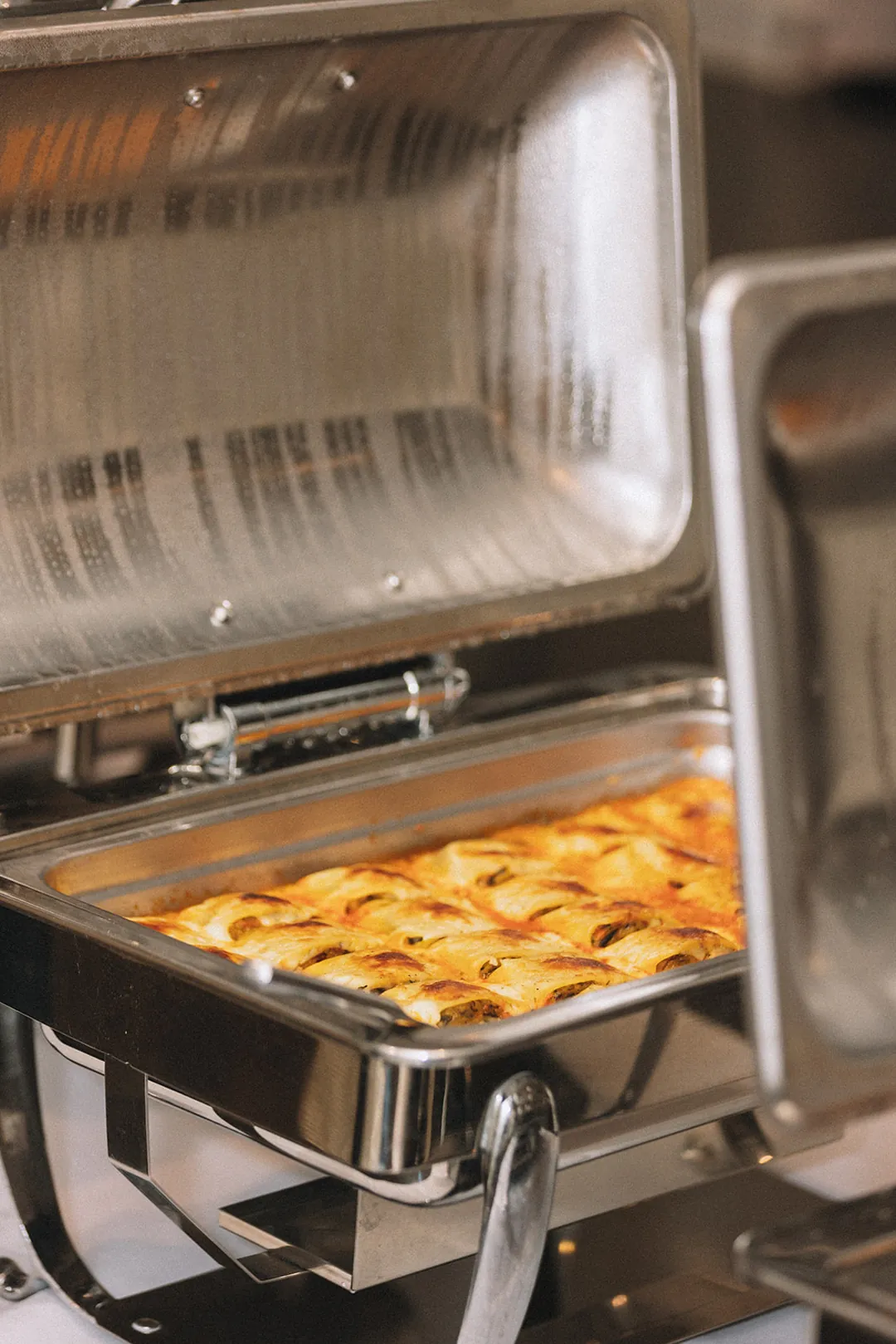 Open buffet tray with a baked dish