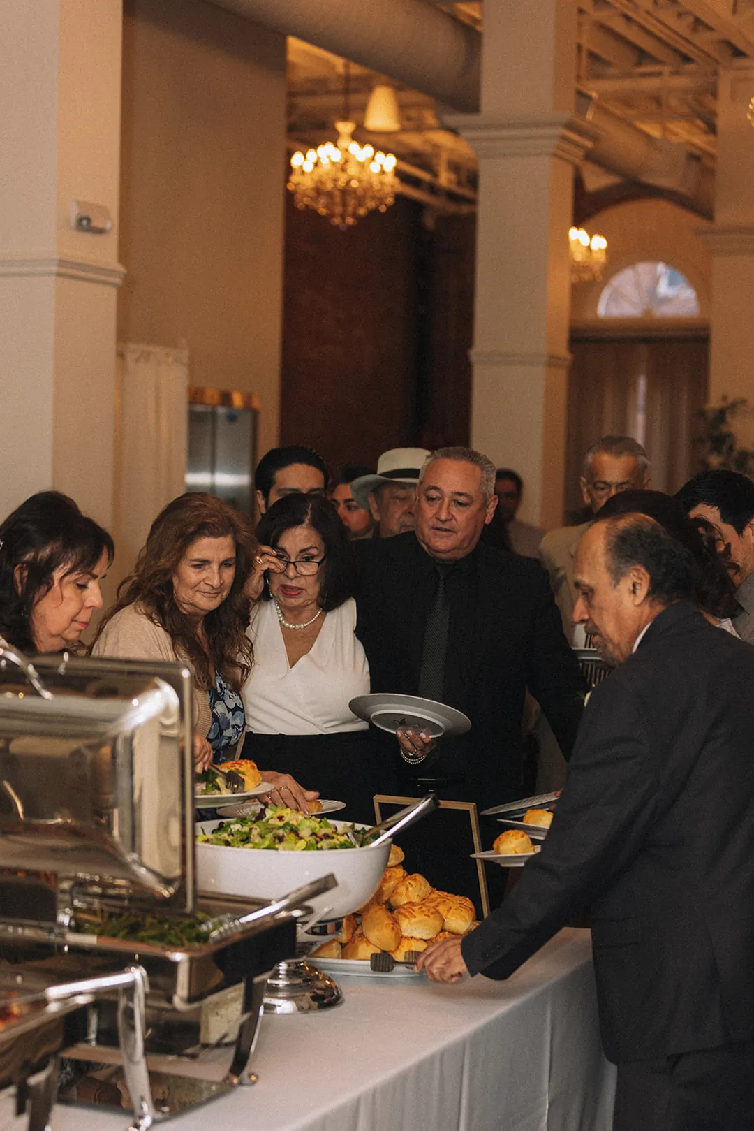 Guests selecting food at a buffet station