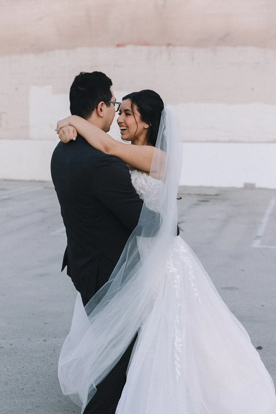 Newlyweds embracing on outdoor steps
