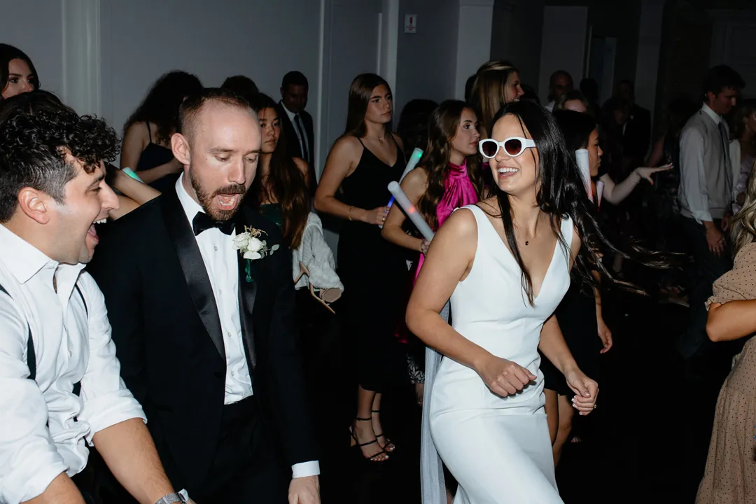 Guests dancing with the newlyweds during the reception
