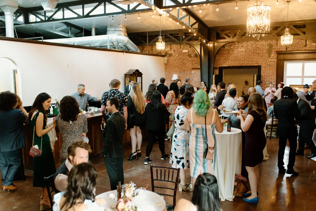 Guests gathered in an open cocktail reception room