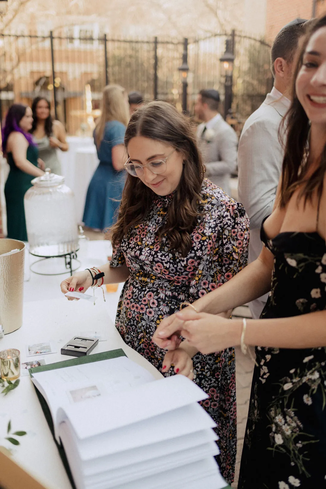 Guests signing a wedding guest book