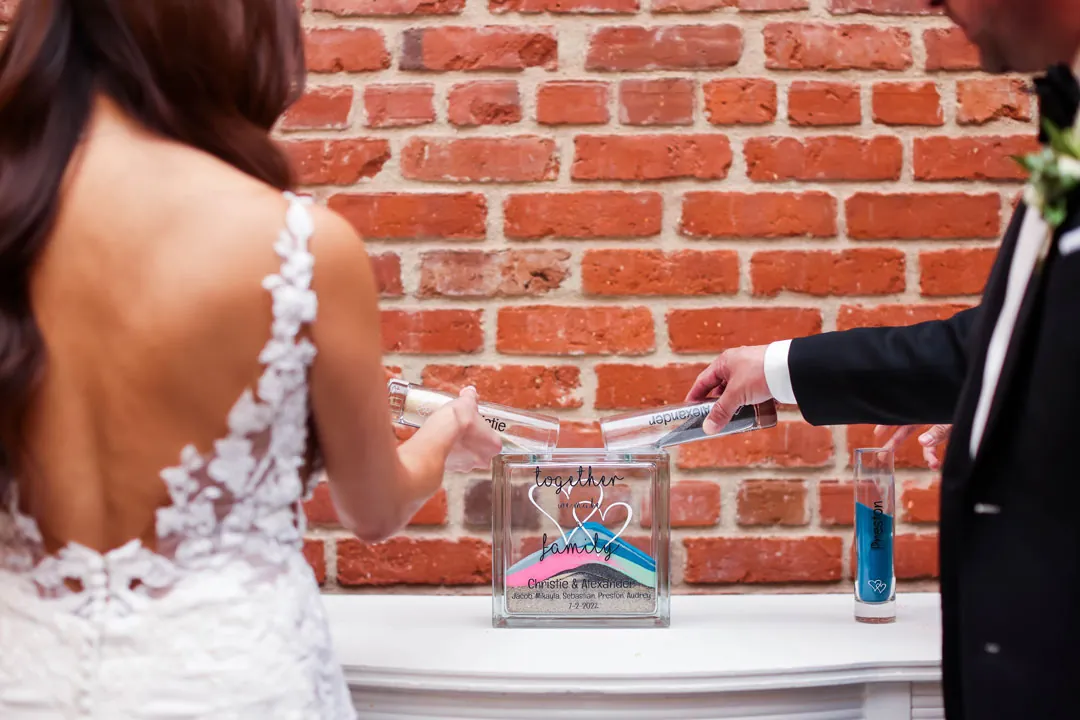 Couple adding colored material to a ceremony keepsake