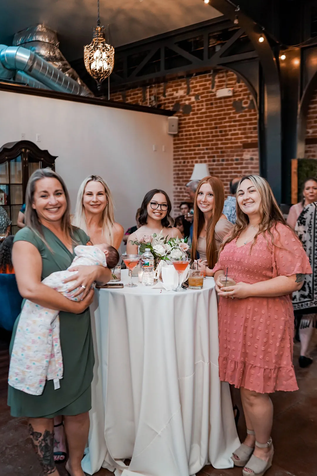 Guests gathered around a cocktail table