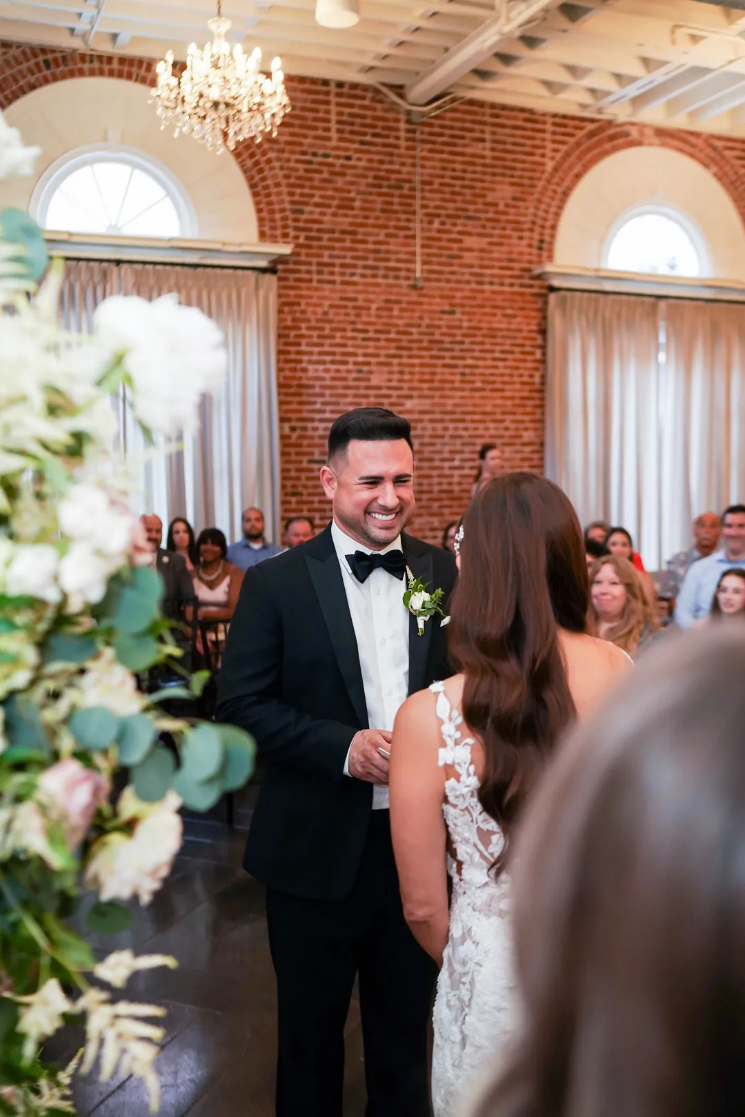 Groom smiling during the wedding ceremony