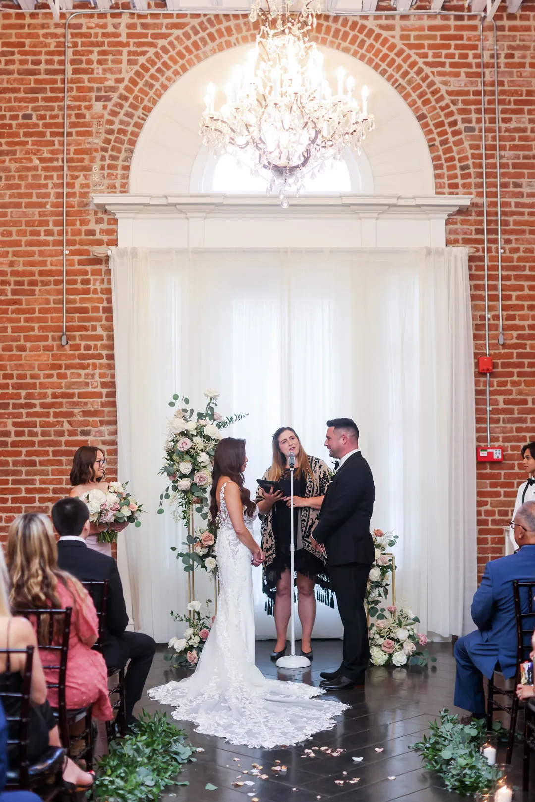 Newlyweds at the front of the ceremony aisle