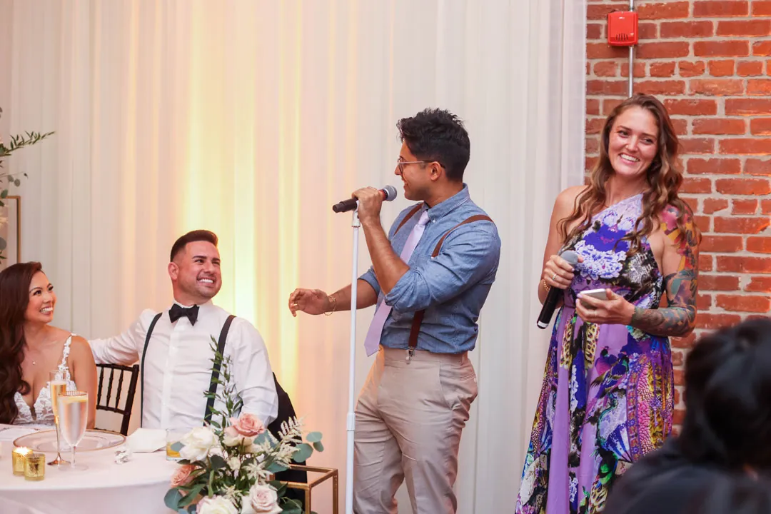 Guests speaking beside the sweetheart table