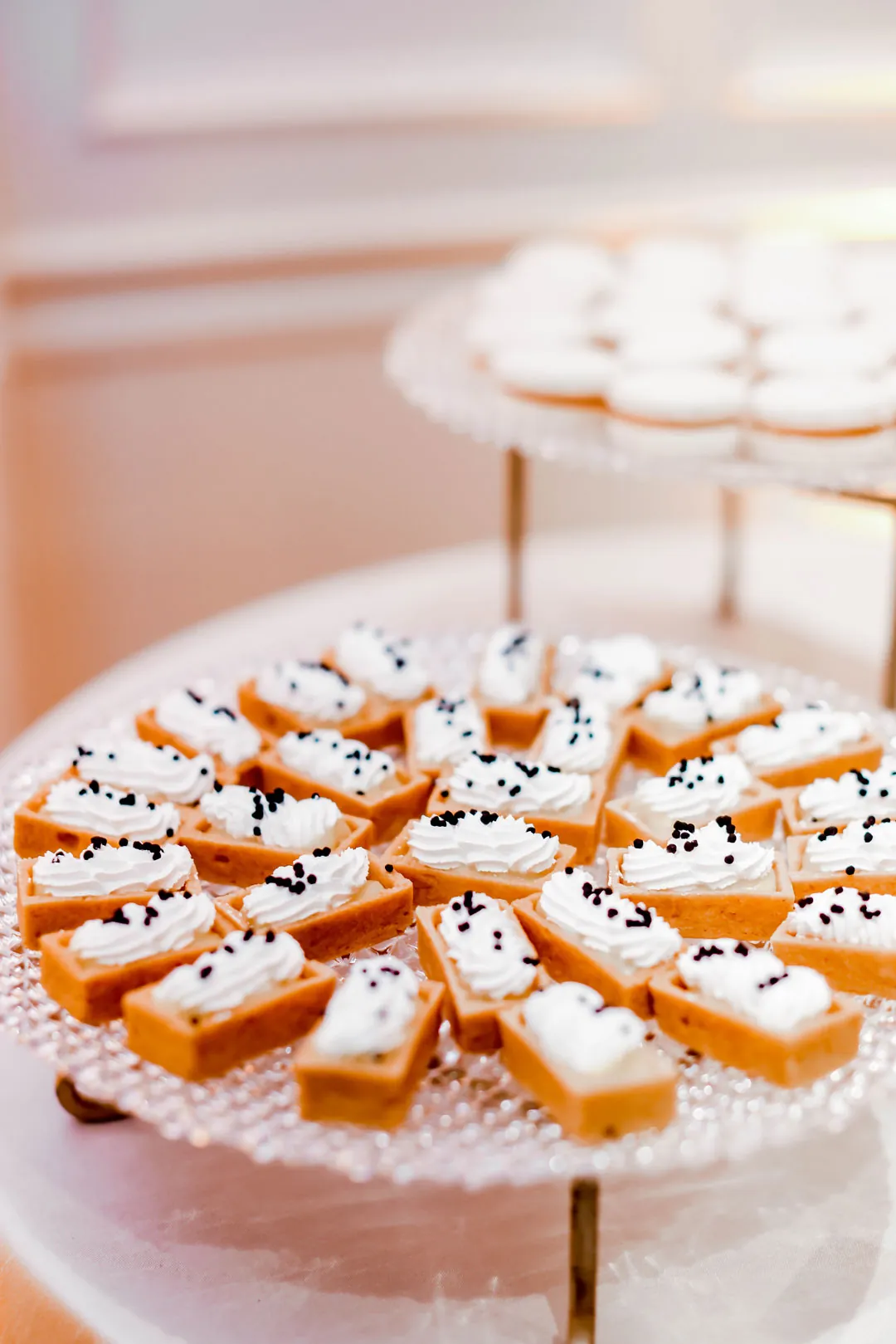 Small pastries on a glass dessert stand