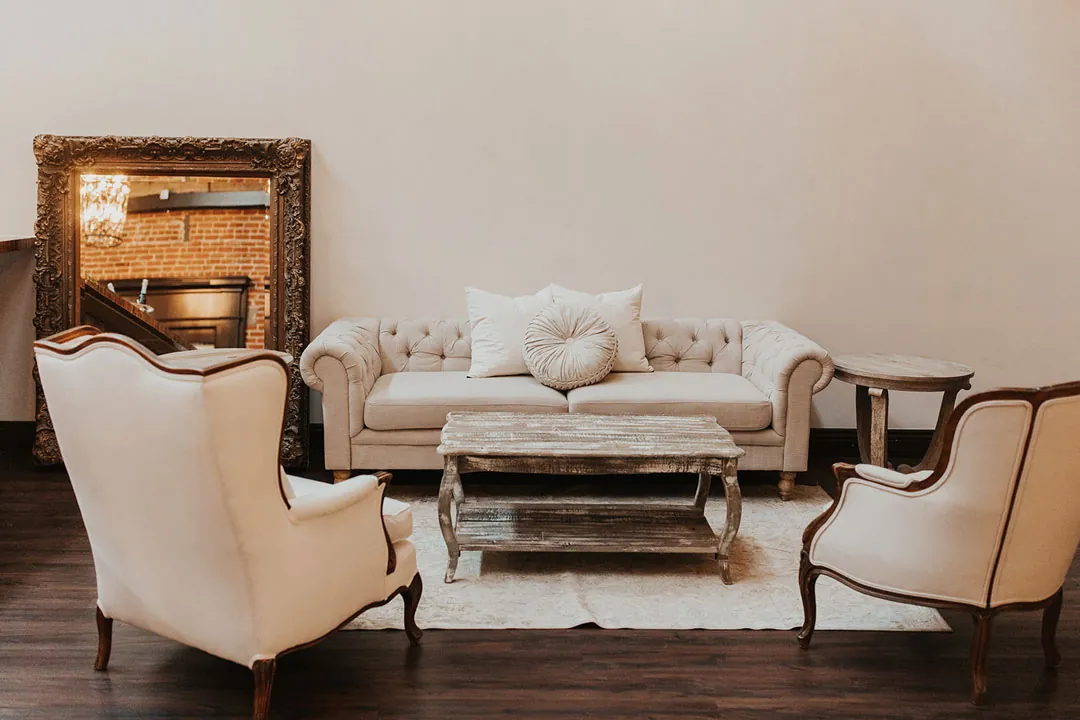 White lounge furniture arranged around a coffee table