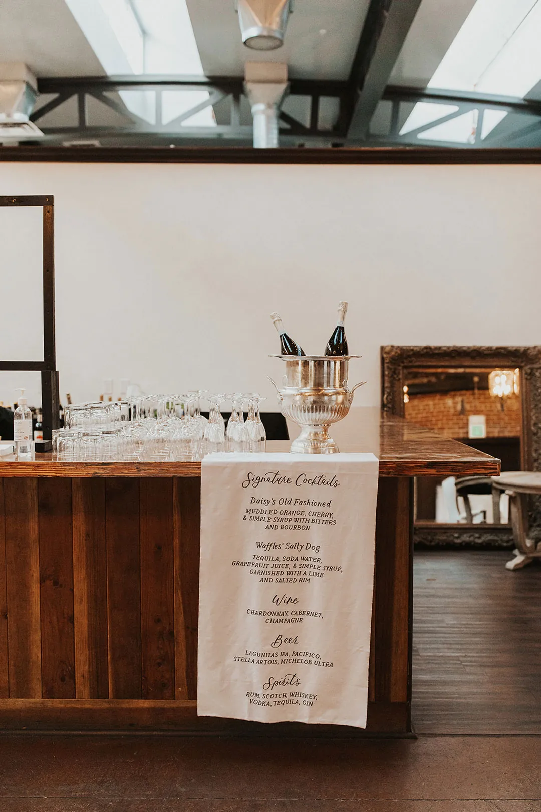 Wedding menu displayed beside a wooden bar