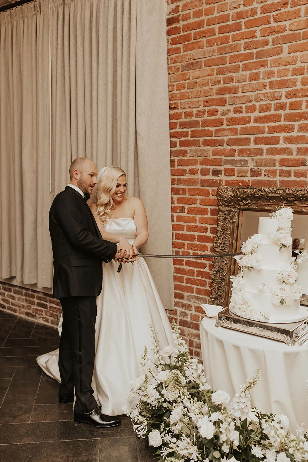 Couple cutting their wedding cake together