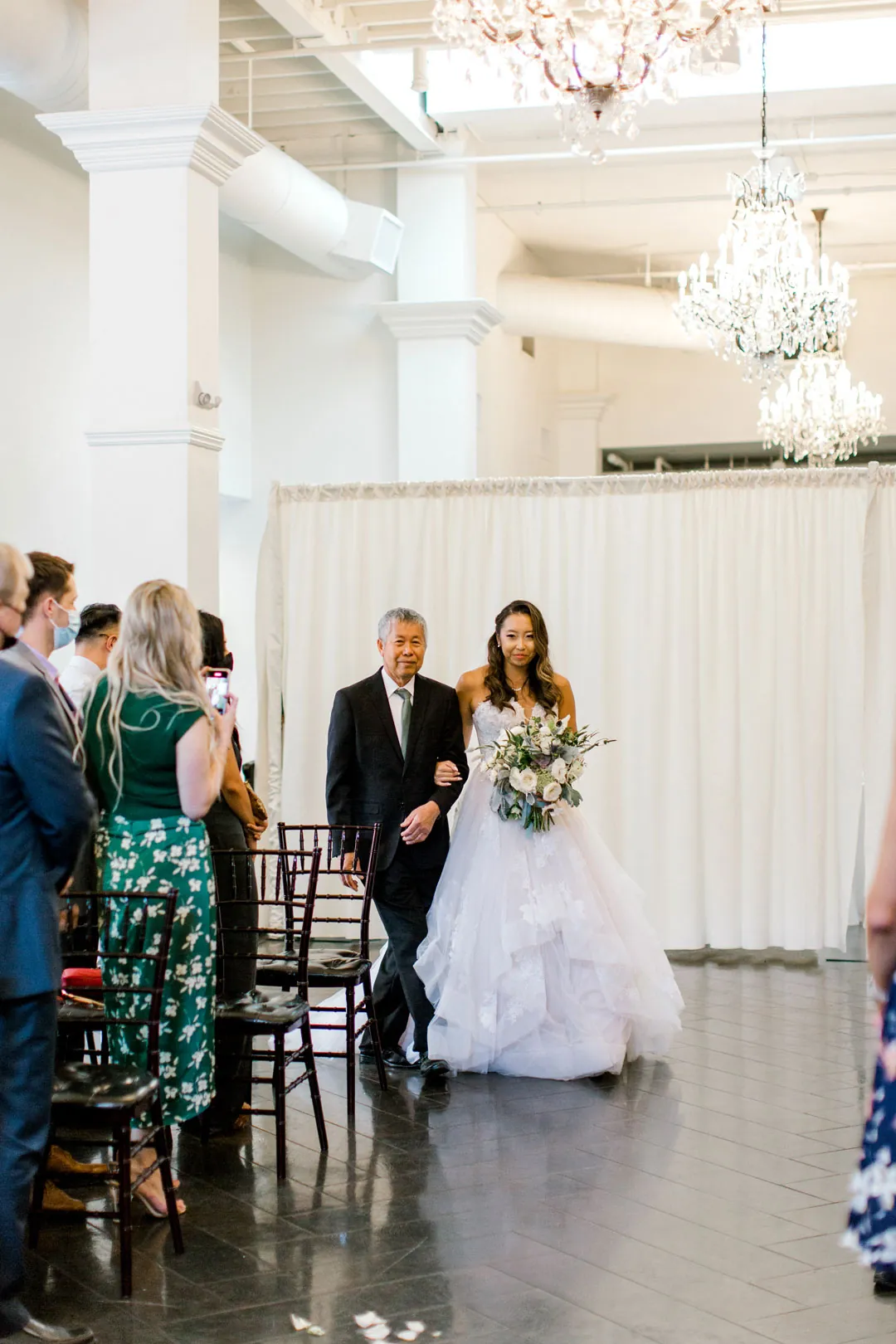 Bride entering the wedding ceremony with an escort