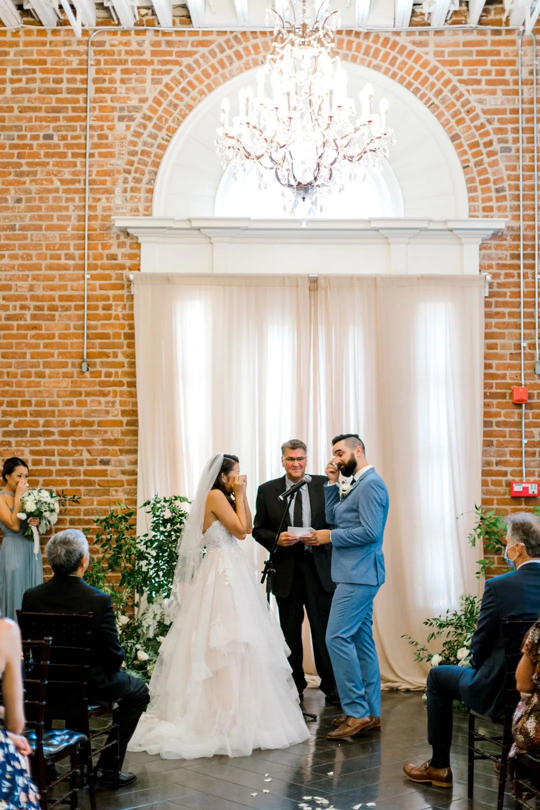 Couple exchanging vows in front of an officiant