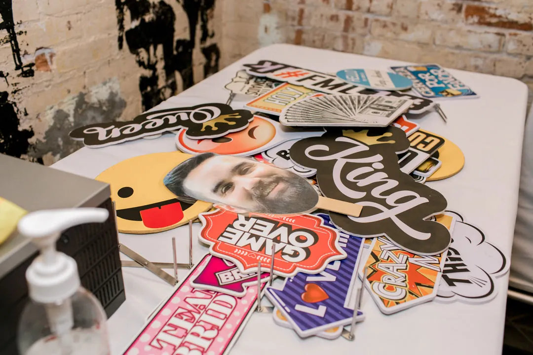 Colorful photo booth props arranged on a table