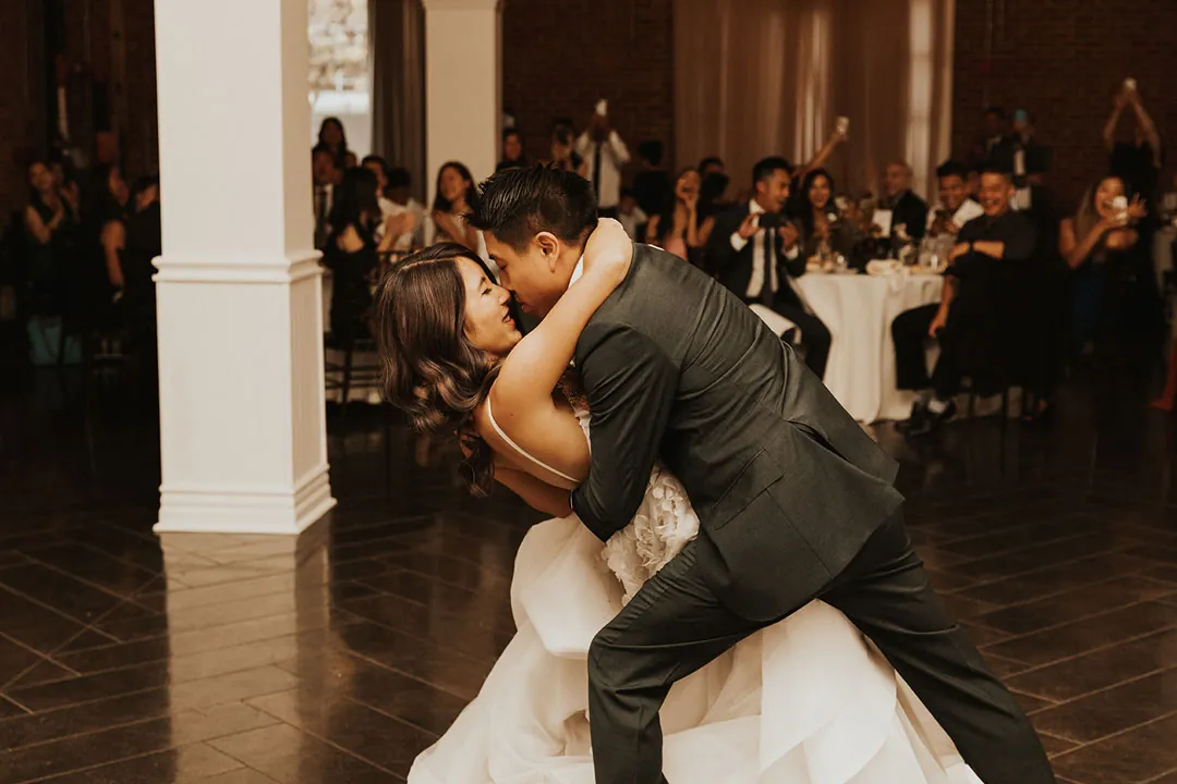 Groom dipping the bride during their first dance