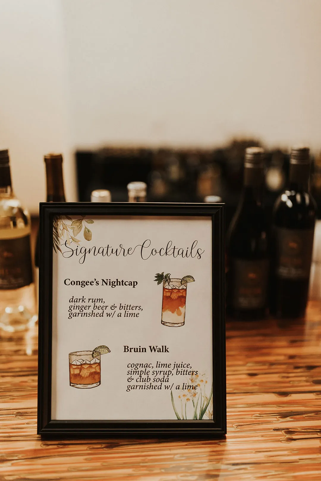 Framed signature-cocktail menu at the bar