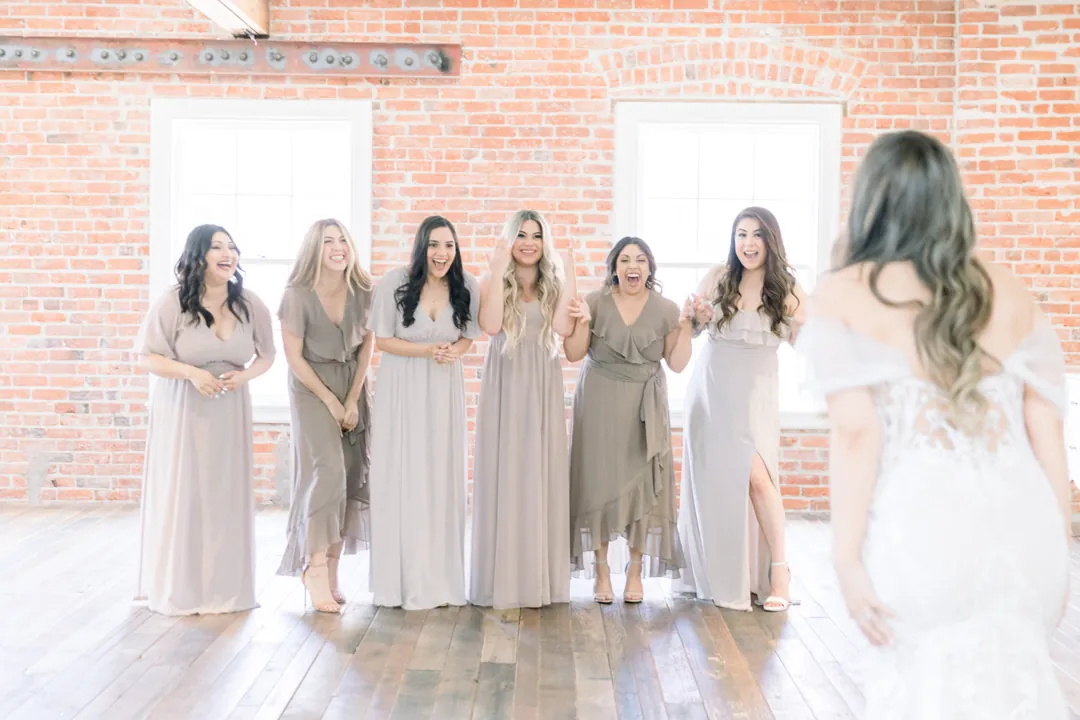 Bride approaching her bridesmaids